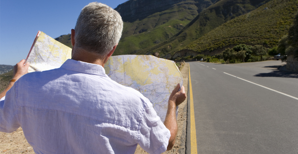 Adobe stock image south africa cape town mature man looking at map by road rear view 02052020